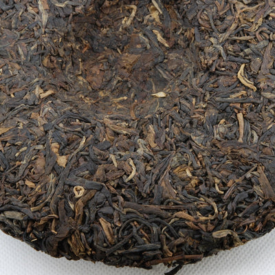 Pu-Erh Tea Cake, Yuenhai Yiwu Mountain Wild Arbor Tea , Year 2003 (Raw/Sheng)
